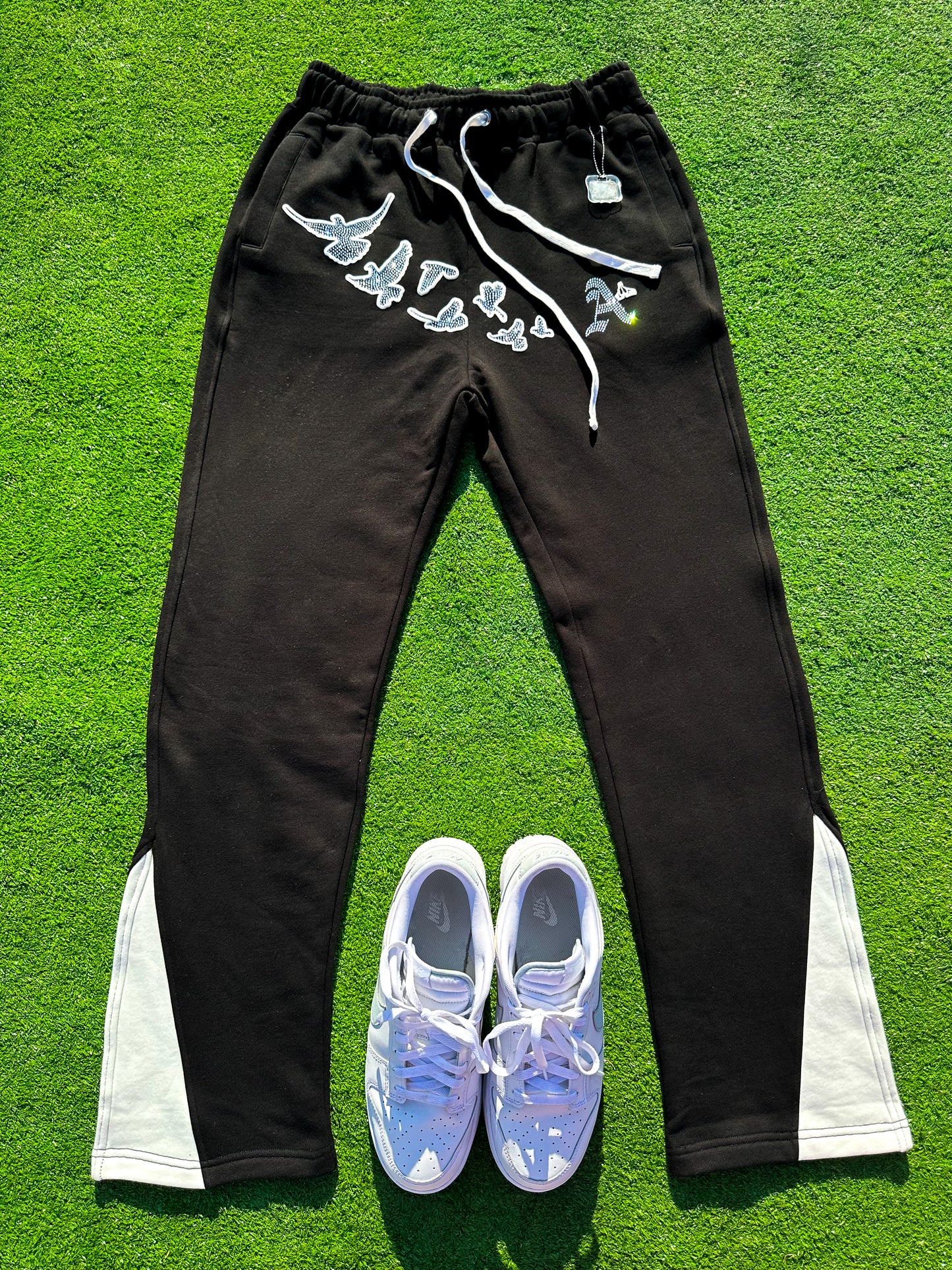 Christian Apparel: All Glory To God ‘Iced Out Flocka Doves’ FlyFleece Flared Sweatpants in Black with dove graphics, bold lettering, and Philippians 4:13. Great for Christian bottoms, Christian streetwear, and Christian athletic wear.
