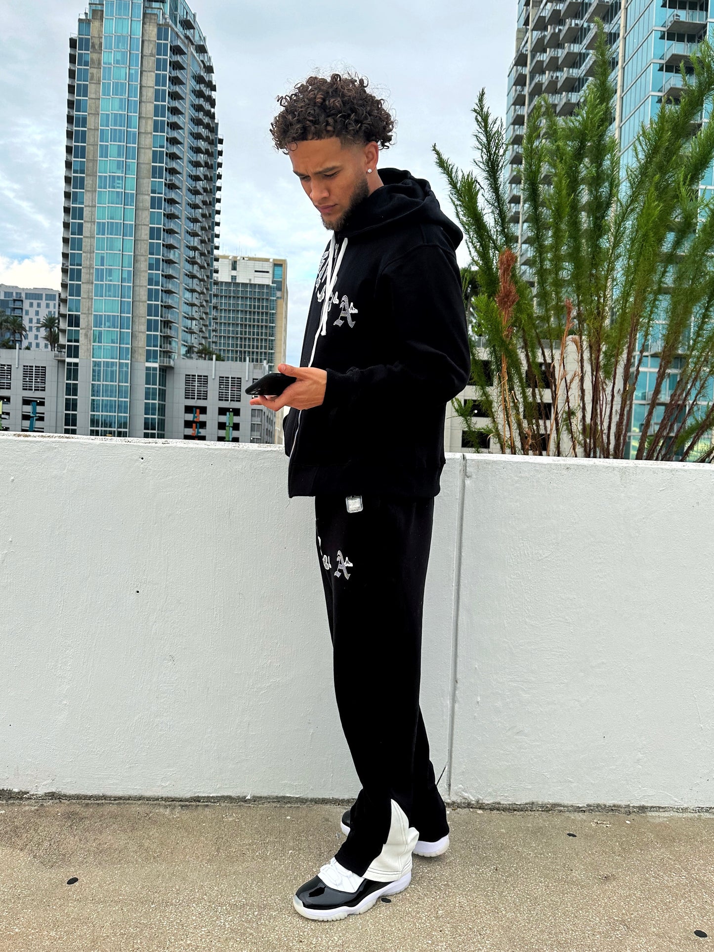 Christian Apparel: All Glory To God ‘Iced Out Flocka Doves’ FlyFleece Flared Sweatpants in Black with dove graphics, bold lettering, and Philippians 4:13. Great for Christian bottoms, Christian streetwear, and Christian athletic wear.
