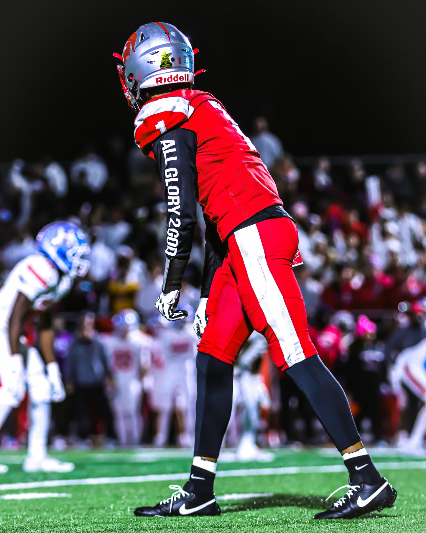 Christian Apparel: All Glory To God ‘Uni’ FlyFit Long Sleeve in Black with football uniform, bold lettering, and Philippians 4:13. Perfect for Christian Long Sleeve T-Shirts, Christian athletic wear, and Christian streetwear.