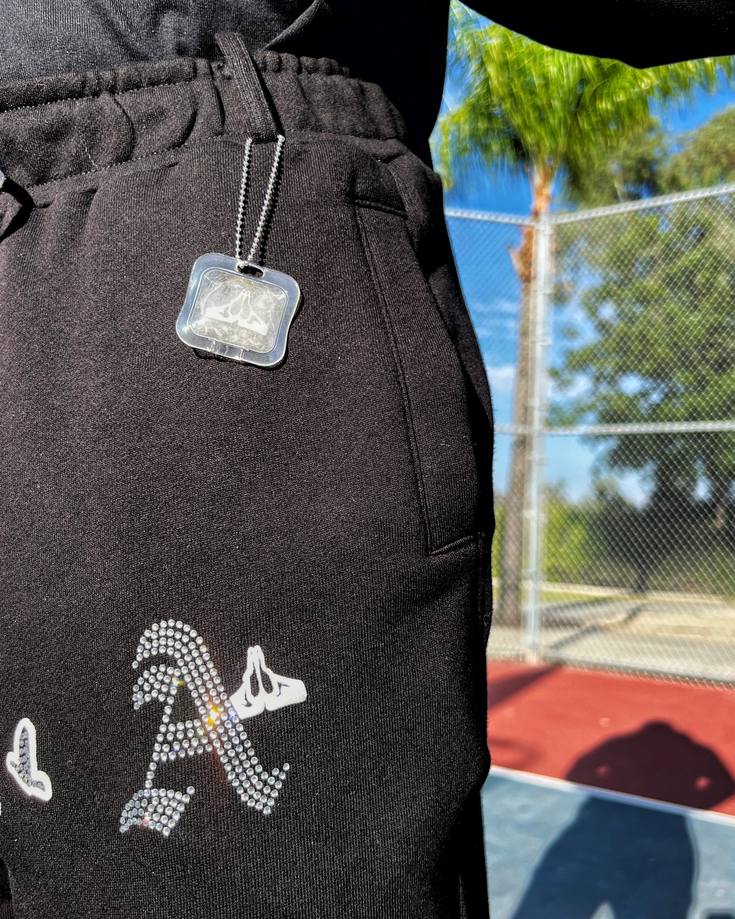 Christian Apparel: All Glory To God ‘Iced Out Flocka Doves’ FlyFleece Flared Sweatpants in Black with dove graphics, bold lettering, and Philippians 4:13. Great for Christian bottoms, Christian streetwear, and Christian athletic wear.