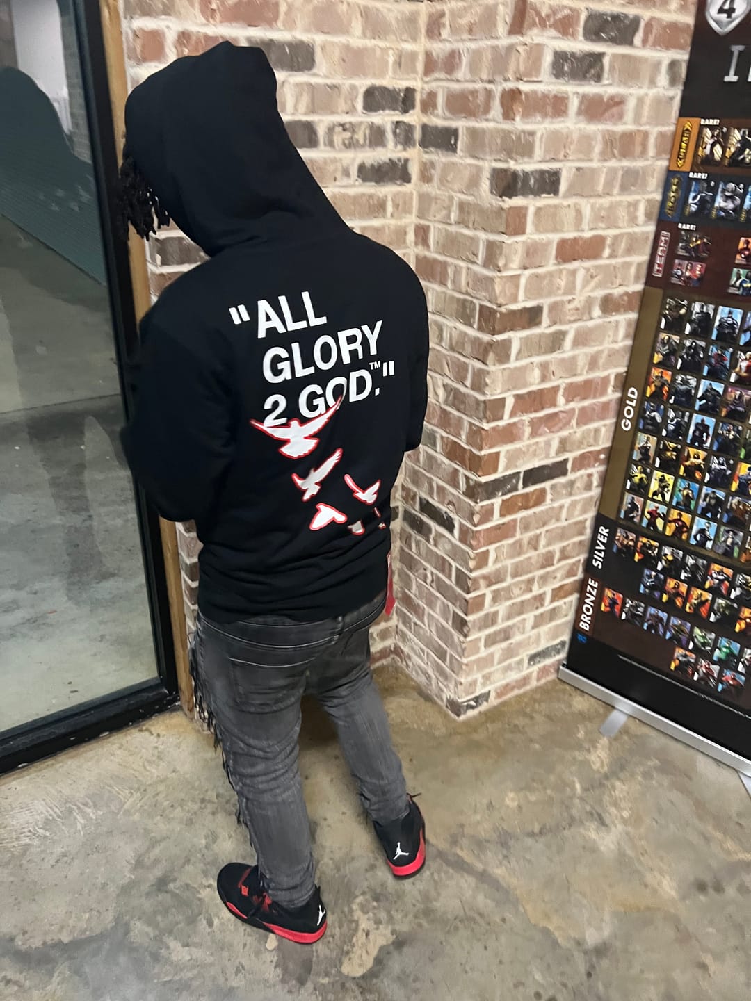 Christian Apparel: All Glory To God ‘Flocka Doves’ Hoodie in Black/Red with dove graphics, bold lettering, and Philippians 4:13. Great for Christian hoodies, Christian streetwear, and Christian athletic wear.