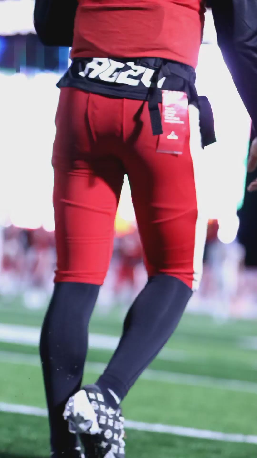 Christian Apparel: All Glory To God ‘Uni’ FlyFit Long Sleeve in Black with football uniform, bold lettering, and Philippians 4:13. Perfect for Christian Long Sleeve T-Shirts, Christian athletic wear, and Christian streetwear.