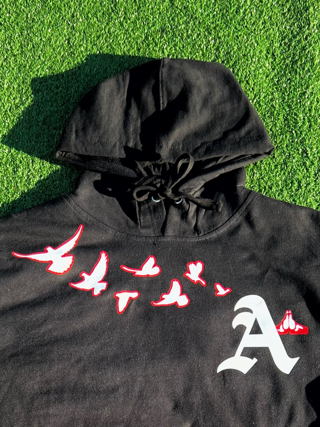 Christian Apparel: All Glory To God ‘Flocka Doves’ Hoodie in Black/Red with dove graphics, bold lettering, and Philippians 4:13. Great for Christian hoodies, Christian streetwear, and Christian athletic wear.