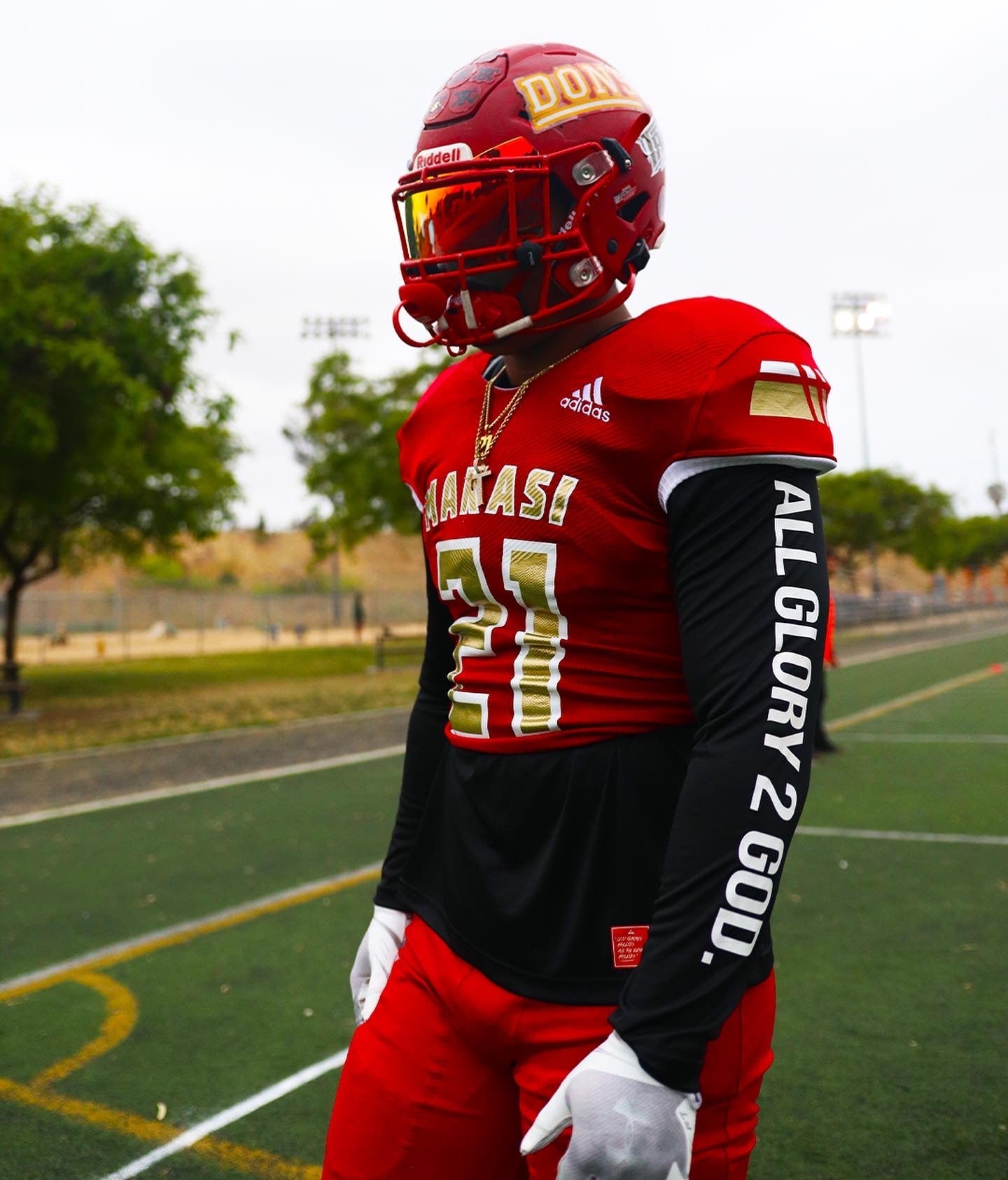 Christian Apparel: All Glory To God ‘Uni’ FlyFit Long Sleeve in Black with football uniform, bold lettering, and Philippians 4:13. Perfect for Christian Long Sleeve T-Shirts, Christian athletic wear, and Christian streetwear.