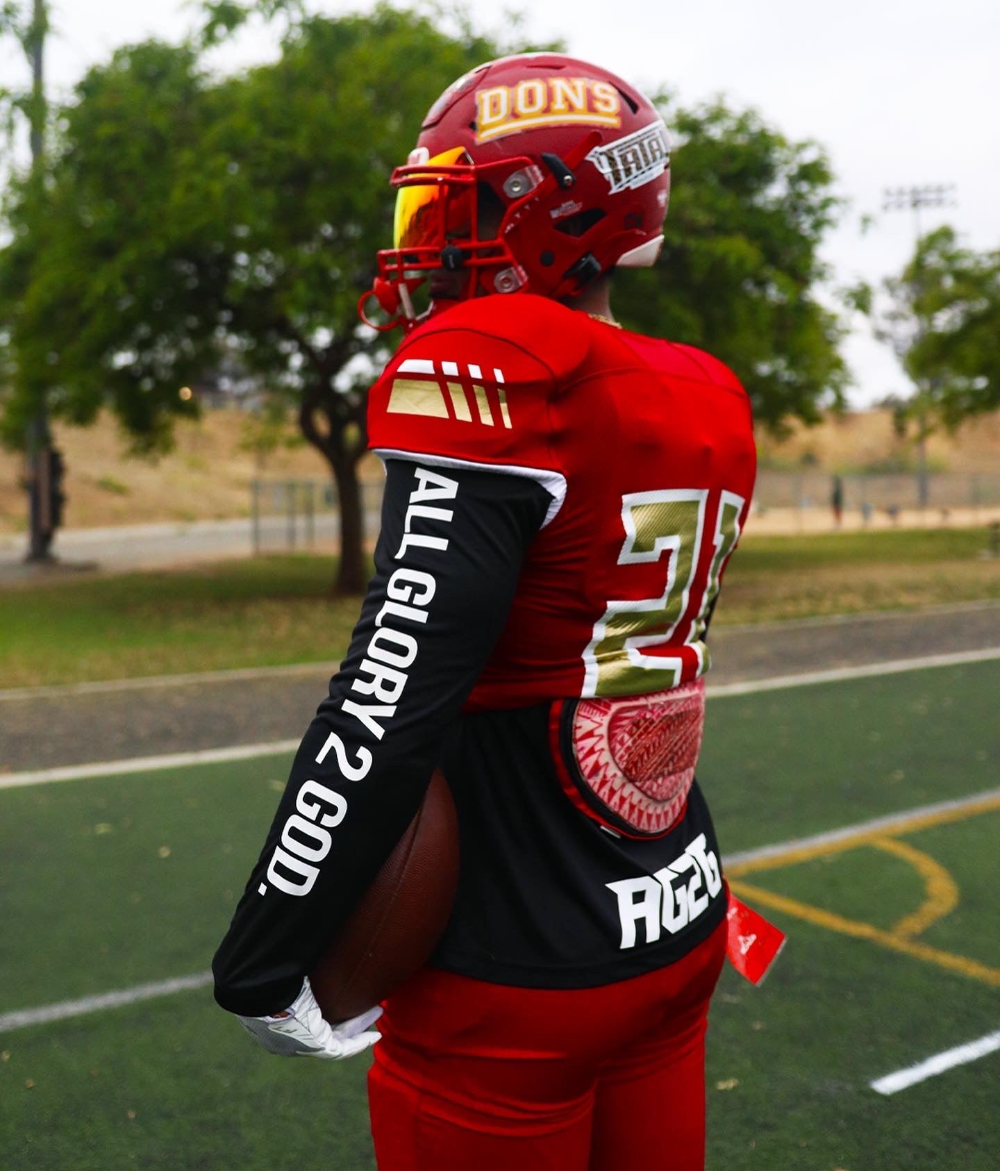 Christian Apparel: All Glory To God ‘Uni’ FlyFit Long Sleeve in Black with football uniform, bold lettering, and Philippians 4:13. Perfect for Christian Long Sleeve T-Shirts, Christian athletic wear, and Christian streetwear.