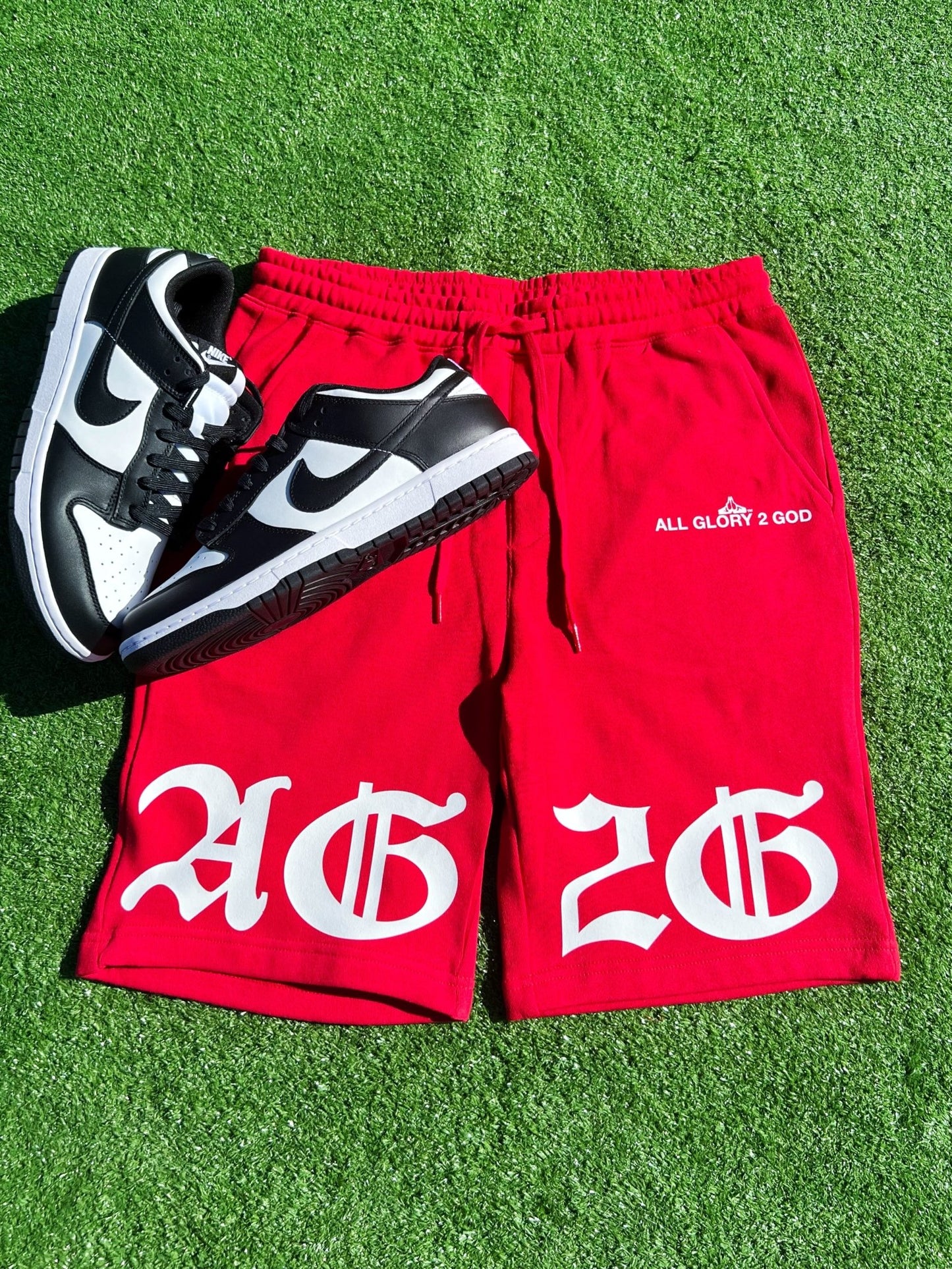 Christian Apparel: All Glory To God ‘Old English KJV’ Fleece Shorts in Red with bold lettering. Great for Christian bottoms, Christian streetwear, and Christian athletic wear.