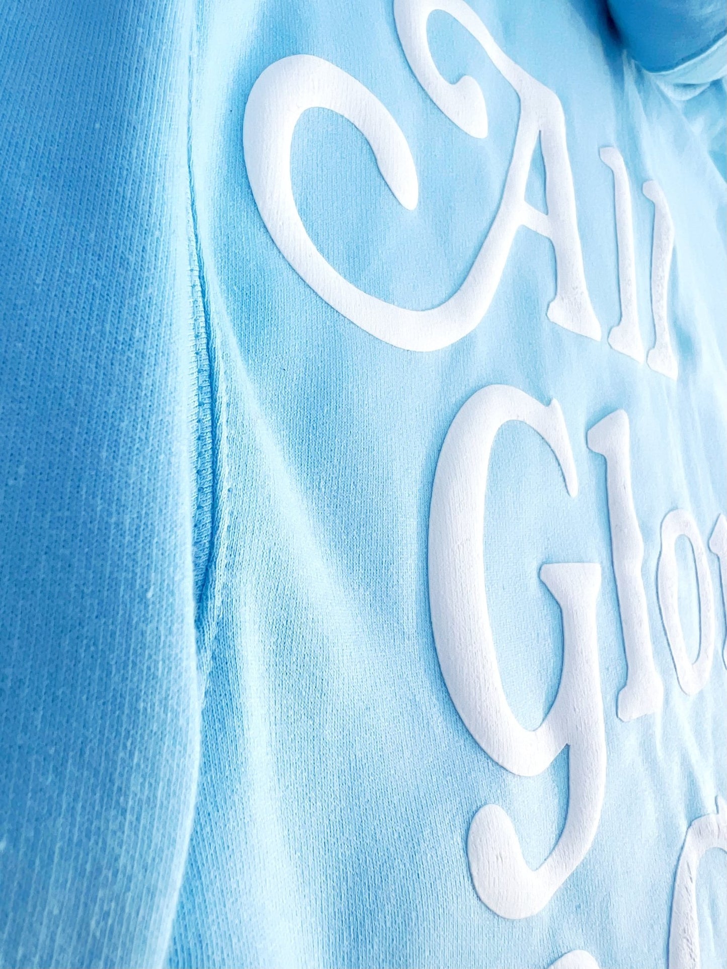 Christian Apparel: All Glory To God ‘Cloud Puff’ Hoodie in Sky Blue featuring a cloud-inspired design. Perfect for Christian hoodies, Christian streetwear, and Christian athletic wear, blending faith, style, and comfort.