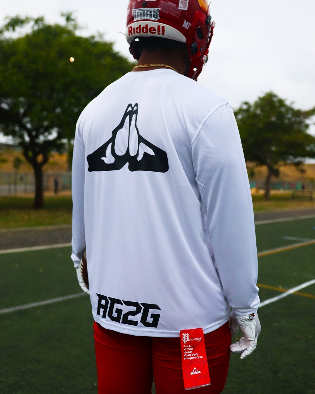 Christian Apparel: All Glory To God ‘Uni’ FlyFit Long Sleeve in White with football uniform, bold lettering, and Philippians 4:13. Perfect for Christian Long Sleeve T-Shirts, Christian athletic wear, and Christian streetwear.