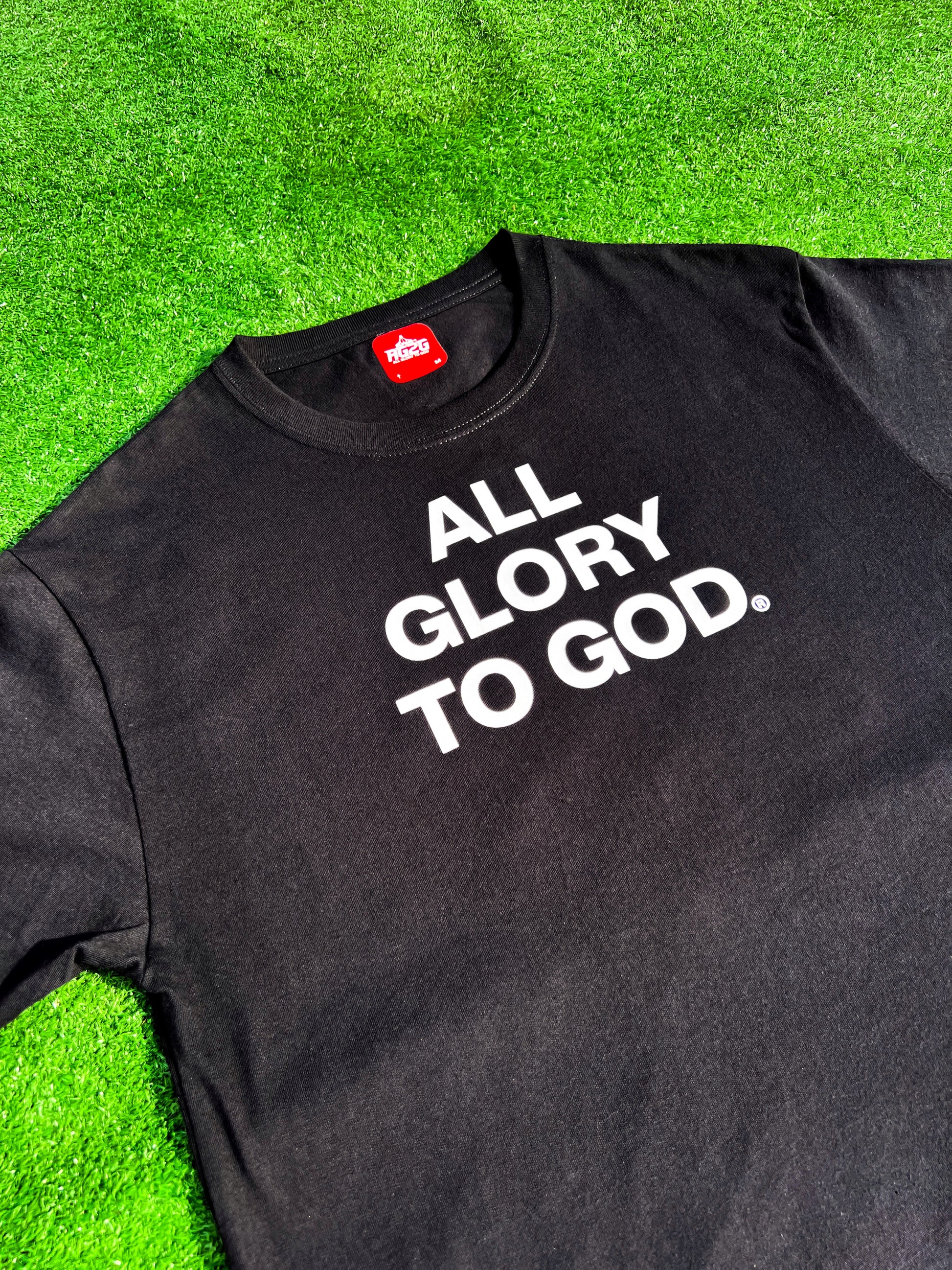 Christian Apparel: All Glory To God ‘Essential’ Tee in Black featuring bold lettering. Perfect for Christian t-shirts, Christian streetwear, and Christian athletic wear, blending faith, style, and comfort.